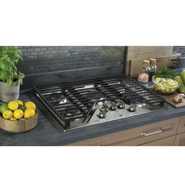 GE Profile 30" Built-In Gas Cooktop with 5 Burners and an Optional Extra-Large Cast Iron Griddle PGP7030SLSS